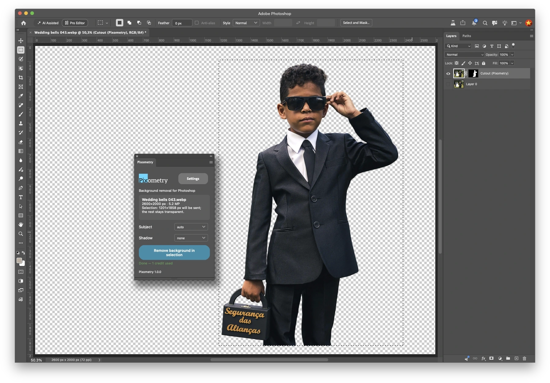The boy cut out cleanly onto a transparent background. The Layers panel shows a new layer named Cutout (Pixometry) with a mask above the original, and the panel reports Done, 1 credit used
